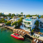 White villas on the water with a red boat in Miami